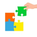 Hand connecting jigsaw puzzle. Business concept. Symbol of teamwork, cooperation, partnership